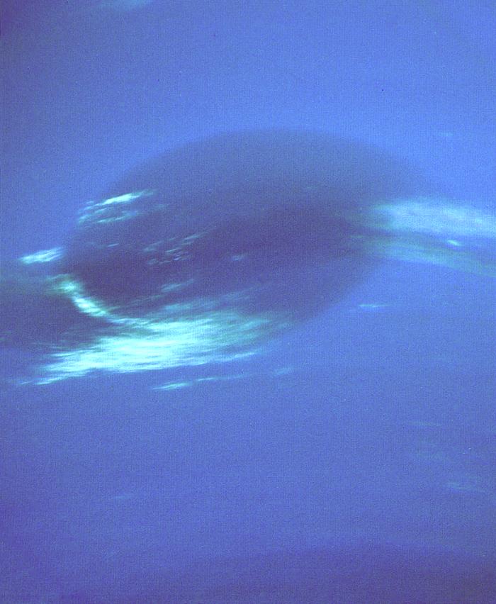 Voyager 2 image of the Great Dark Spot with bright companion clouds in Neptune’s atmosphere