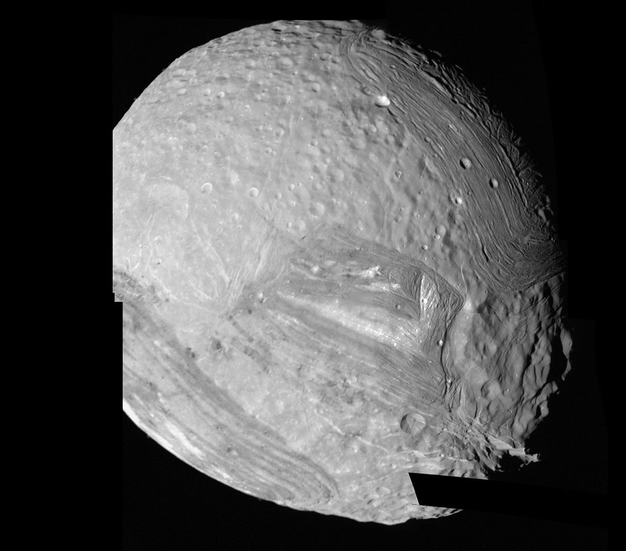 Voyager 2 mosaic of Miranda showing abrupt boundaries between ridged and cratered terrains