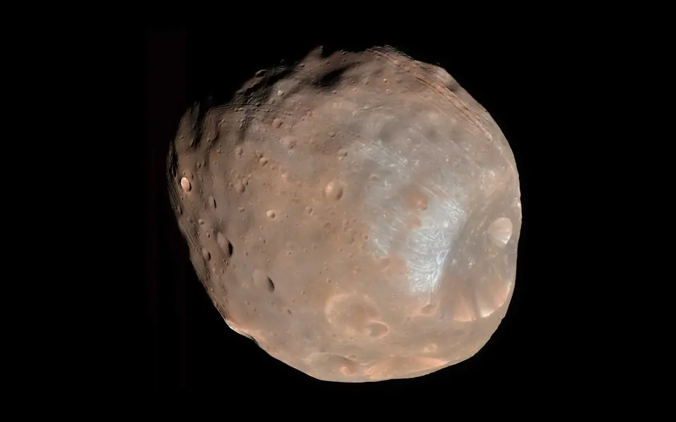 Actual Mars Reconnaissance Orbiter image of the irregular cratered surface of Phobos